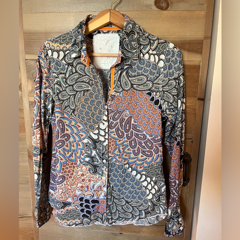 Cuno mixed paisleys in blues and deep orange.